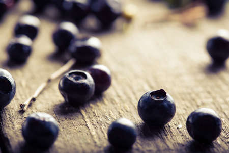 blueberry berries on a wooden table close upの写真素材