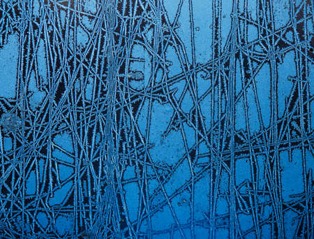 background made of winter frozen window glassの写真素材