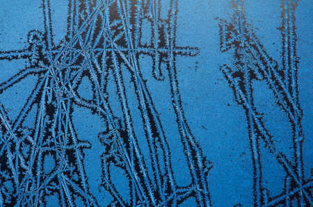 background made of winter frozen window glassの写真素材