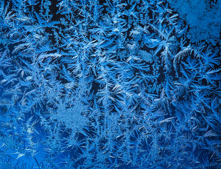 background made of winter frozen window glassの写真素材