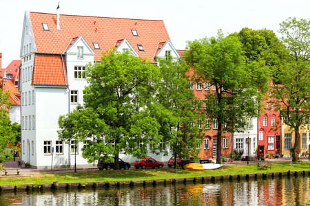 houses on the bank of the river Trave, Lubeckの写真素材