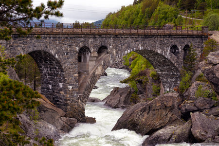 old beautiful arched brick bridge in the Norwegian mountains, Norway