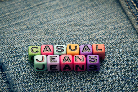 cubes with letters casual jeans on a jeans backgroundの写真素材