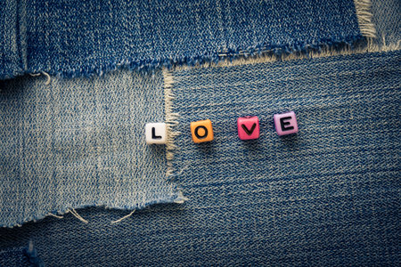 cubes with letters love on a jeans background