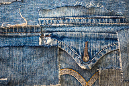 background made of old jeans rags close up