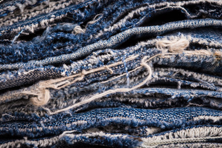 background made of old jeans rags close up