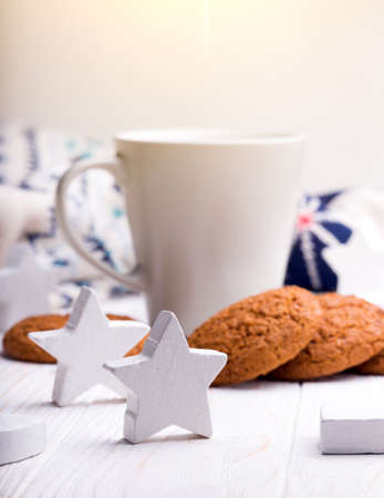 cup of coffee with oat cookies and Christmas decorationsの写真素材
