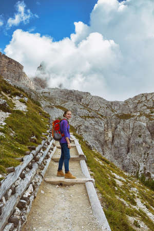 girl hiker hiking at the  Tre Cime di Lavaredo. Dolomites, Italy.の写真素材