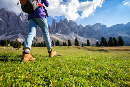 hiking boots close-up. tourist walking at the Puez Odle. Italy
の写真素材