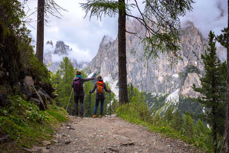 girls hiker looking at the mountains Dolomites, Italyの写真素材