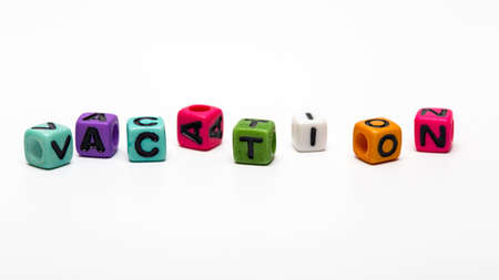 vacation - word made from multicolored child toy cubes with lettersの写真素材