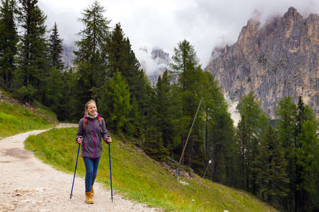 happy girl hiker looking at the mountains Dolomites, Italy
の写真素材