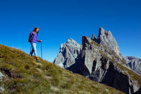 girl hiker at the mountains Dolomites and views of the valley, Italy. Secedaの写真素材