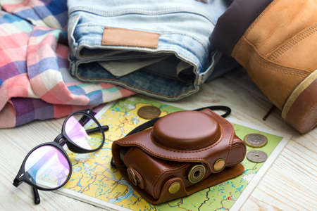 background - what to take for a trip.  clothes, shoes, money, map, camera, accessories, sunglasses の写真素材