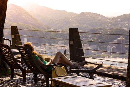 girl tourist with a backpack on the background Rio de Janeiro. view from Pao de Acucar. Brasil
の写真素材