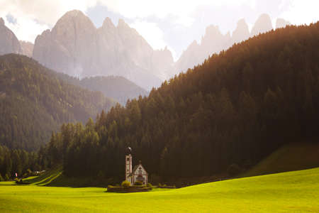 world famous Saint Johann church at the Dolomites alps in sunset time. Italy.の写真素材