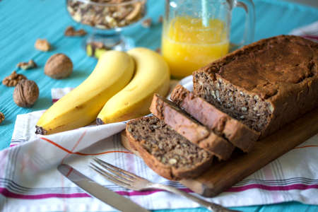 Healthy eating. Banana bread, bananas and orange juice on the tableの写真素材
