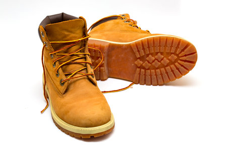 yellow leather trekking boots isolated on a white