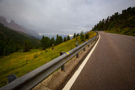 mountain road at the Dolomites at the cloudy dayの写真素材