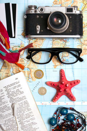 Background - what to take for a trip. passport, phone, documents, car keys, map, camera, money, sunglasses, credit cardsの写真素材