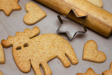 beautiful delicious christmas gingerbread at the wooden background and bumps in the foregroundの写真素材