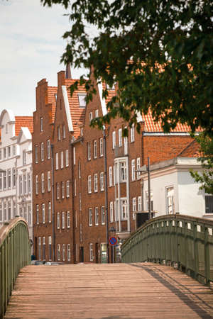 bridge and houses on the bank of the river Trave, Lubeckの写真素材