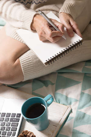 background - beautiful cozy morning and and the girl is planning her dayの写真素材