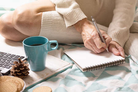 background - beautiful cozy morning and and the girl is planning her dayの写真素材