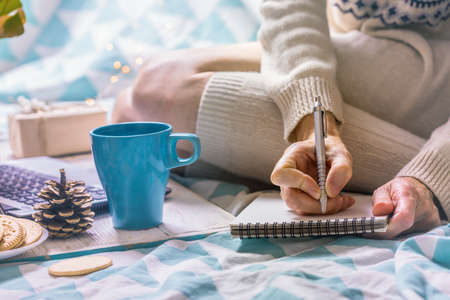 background - beautiful cozy morning and and the girl is planning her dayの写真素材