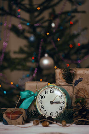 Christmas backgrounds. Gifts and Christmas decor on the wooden background.
の写真素材