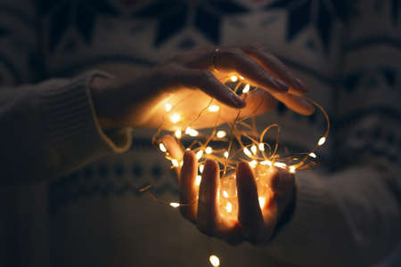 Christmas garland in the hands of a girl
の写真素材