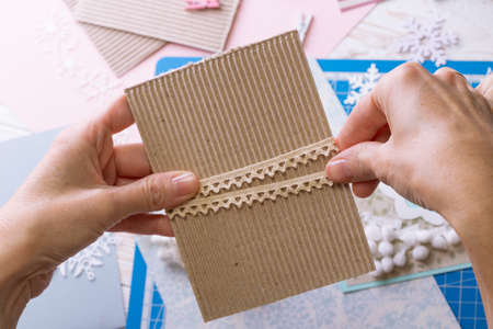 scrapbook background. Girl make christmas card and tools with decoration の写真素材