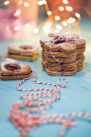 Classic Linzer Cookies close-up and side bokeh in the background, christmas