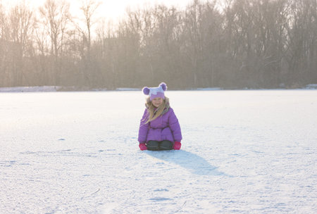 happy smiling girl on a winter walkの写真素材
