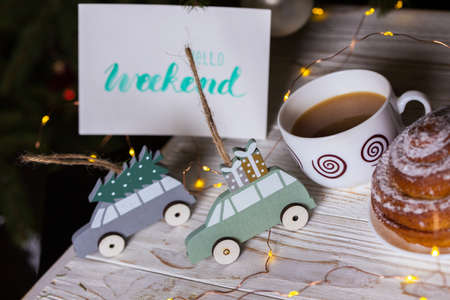 christmas. New Year's toys and inscription hello weekend on the background of the Christmas treeの写真素材