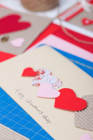 scrapbook background. girl holding a postcard on the valentines day