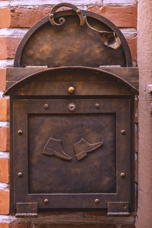 unusual letter-box on a wallの写真素材