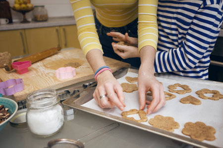 happy weekend - Sister girls cook a Linzer Cookies in the kitchenの写真素材