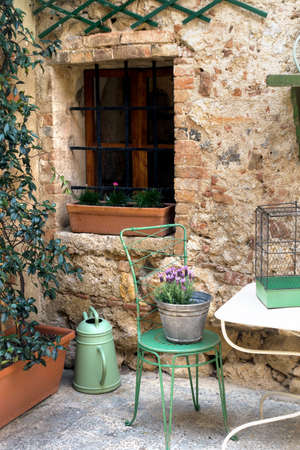 Small patio with tables and chairs. Italyの写真素材