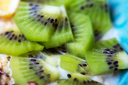 sliced appetizing and juicy kiwi close-upの写真素材