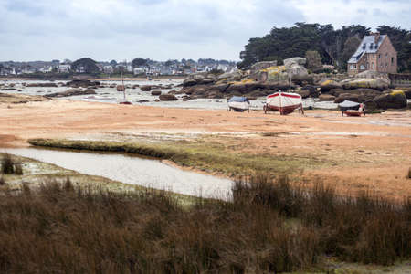 Tregastel. boats at low tide on the coast of Brittany, France
の写真素材