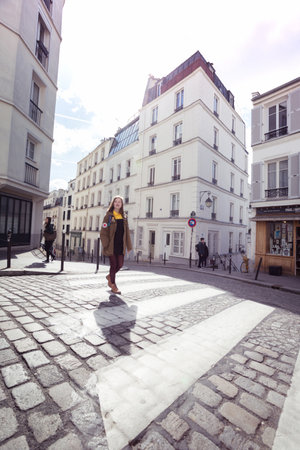 PARIS, FRANCE - MARCH 29, 2018: girl is walks around Montmartre. Paris, France 
のeditorial素材