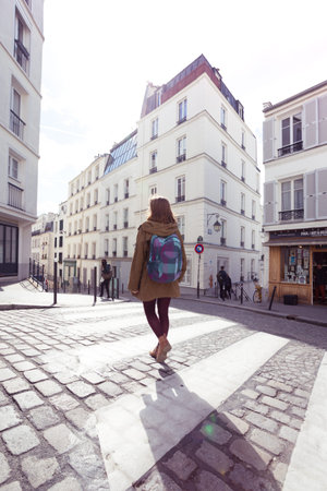 PARIS, FRANCE - MARCH 29, 2018: girl is walks around Montmartre. Paris, France のeditorial素材
