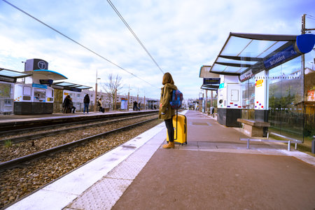 PARIS, FRANCE - APRIL 04, 2018: view of Belvedere platform and girl waiting for the trainのeditorial素材