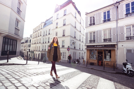PARIS, FRANCE - MARCH 29, 2018: girl is walks around Montmartre. Paris, France のeditorial素材