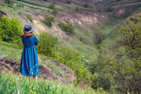 summer - girl in hat walks on the background of the traditional Ukrainian landscapeの写真素材
