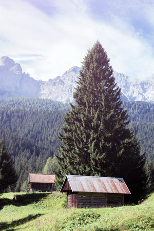 beautiful landscape and small wooden house in the mountains. Dolomites, Italy