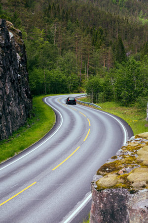 beautiful windy road at the norwegian mountains, norwayの写真素材