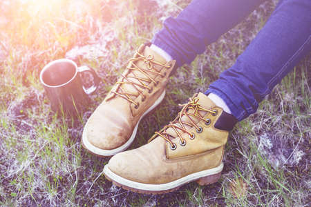 hiking boots girl hiker and a cupの写真素材