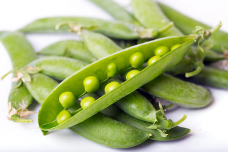 green peas on a white background. raw diet